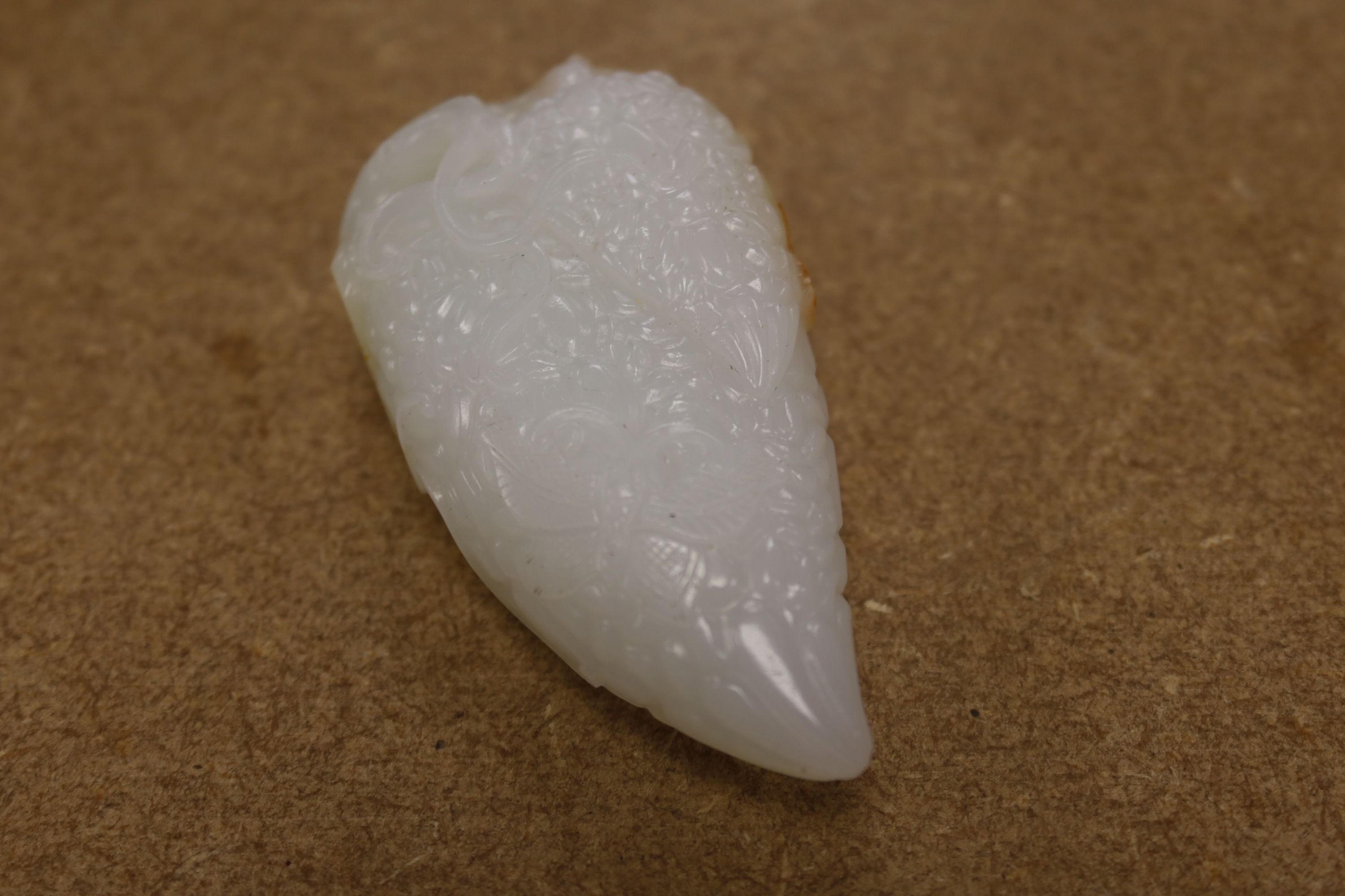 A Chinese white and russet skin jade carving, 7cm high